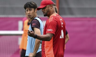 FC Bayern Munich's new head coach Vincent Kompany, right, an new player Hiroki Ito, left, attend a team's training session in Munich, Germany, Wednesday, July 17, 2024. (Sven Hoppe/dpa via AP)