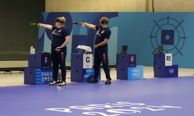 Serbia's Zorana Arunovic, left, and Damir Mikec compete in the 10m air pistol mixed team gold medal event at the 2024 Summer Olympics, Tuesday, July 30, 2024, in Chateauroux, France. (AP Photo/Manish Swarup)