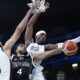 Carlik Jones, of South Sudan, shoots between Derrick White, (8) and Jayson Tatum, of the United States, in a men's basketball game at the 2024 Summer Olympics, Wednesday, July 31, 2024, in Villeneuve-d'Ascq, France. (AP Photo/Mark J. Terrill)