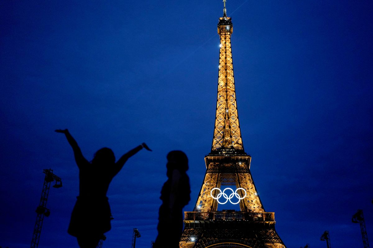 The United States' Amarilees Bolorin, left, takes a selfie with a friend in front of the Eiffel Tower ahead of the 2024 Summer Olympics, Thursday, July 25, 2024, in Paris, France. (AP Photo/Natacha Pisarenko)