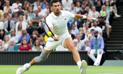 Novak Djokovic of Serbia plays a forehand return to Hulger Rune of Denmark during their fourth round match at the Wimbledon tennis championships in London, Monday, July 8, 2024. (AP Photo/Kirsty Wigglesworth)