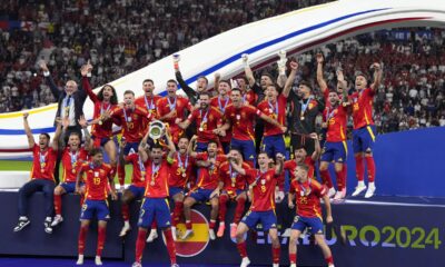 Spain's Alvaro Morata lifts the trophy after winning the final match between Spain and England at the Euro 2024 soccer tournament in Berlin, Germany, Sunday, July 14, 2024. Spain won 2-1. (AP Photo/Manu Fernandez)