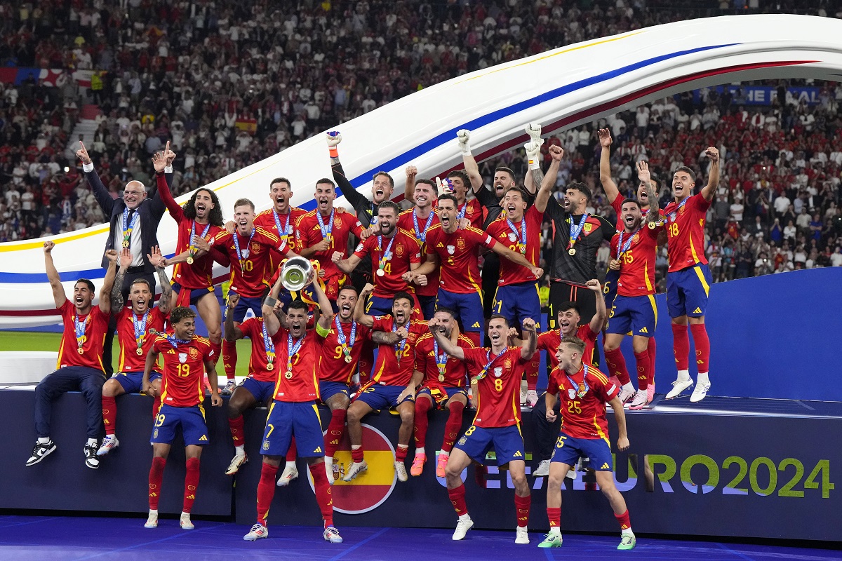 Spain's Alvaro Morata lifts the trophy after winning the final match between Spain and England at the Euro 2024 soccer tournament in Berlin, Germany, Sunday, July 14, 2024. Spain won 2-1. (AP Photo/Manu Fernandez)