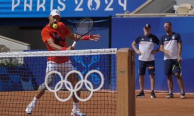 Novak Djokovic of Serbia returns the ball during a practice session ahead of the tennis competition, at the 2024 Summer Olympics, Thursday, July 25, 2024, in Paris, France. (AP Photo/Andy Wong)