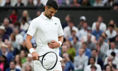 Novak Djokovic of Serbia reacts during his fourth round match against Hulger Rune of Denmark at the Wimbledon tennis championships in London, Monday, July 8, 2024. (AP Photo/Kirsty Wigglesworth)