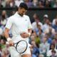 Novak Djokovic of Serbia reacts during his fourth round match against Hulger Rune of Denmark at the Wimbledon tennis championships in London, Monday, July 8, 2024. (AP Photo/Kirsty Wigglesworth)