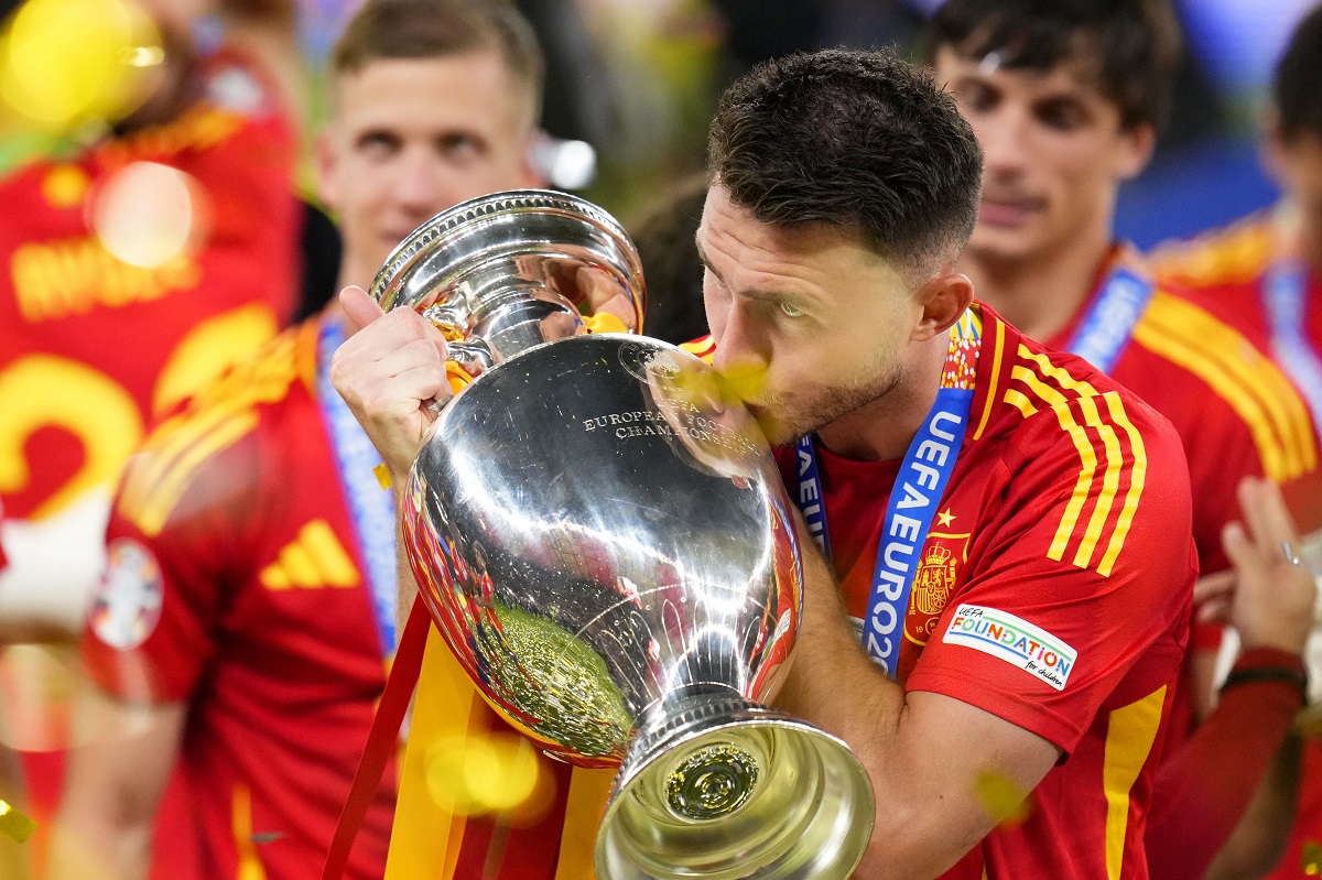 Spain's Aymeric Laporte kisses the trophy after winning the final match between Spain and England at the Euro 2024 soccer tournament in Berlin, Germany, Sunday, July 14, 2024. Spain won 2-1. (AP Photo/Manu Fernandez)