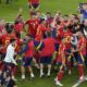 Spain's players celebrate after their team defeated England 2-1 at the end of the final match at the Euro 2024 soccer tournament in Berlin, Germany, Sunday, July 14, 2024. (AP Photo/Thanassis Stavrakis)