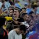 Uruguay's players argue with fans at the end of a Copa America semifinal soccer match against Colombia in Charlotte, N.C., Wednesday, July 10, 2024. (AP Photo/Julia Nikhinson)