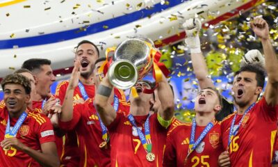 Spain's Alvaro Morata lifts the trophy after winning the final match between Spain and England at the Euro 2024 soccer tournament in Berlin, Germany, Sunday, July 14, 2024. Spain won 2-1. (AP Photo/Manu Fernandez)
