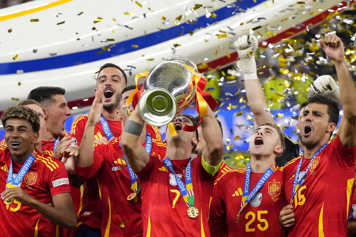 Spain's Alvaro Morata lifts the trophy after winning the final match between Spain and England at the Euro 2024 soccer tournament in Berlin, Germany, Sunday, July 14, 2024. Spain won 2-1. (AP Photo/Manu Fernandez)