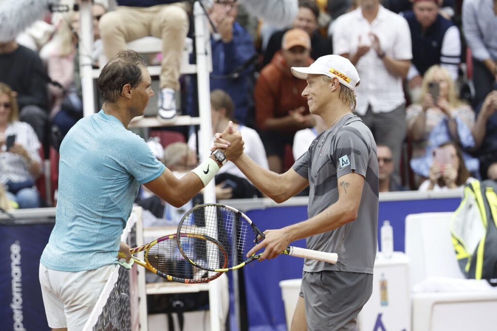 Rafael Nadal of Spain, left, greets Leo Borg of Sweden after winning their men's singles match at the Nordea Open Tennis tournament in Bastad, Sweden, Tuesday July 16, 2024. (Adam Ihse/TT News Agency via AP)