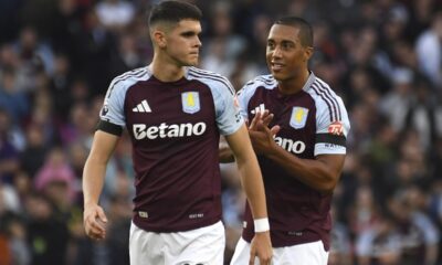 Aston Villa's Kosta Nedeljkovic, left, and Aston Villa's Youri Tielemans during the English Premier League soccer match between Aston Villa and Arsenal at Villa Park in Birmingham, England, Saturday, Aug. 24, 2024. (AP Photo/Rui Vieira)