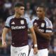 Aston Villa's Kosta Nedeljkovic, left, and Aston Villa's Youri Tielemans during the English Premier League soccer match between Aston Villa and Arsenal at Villa Park in Birmingham, England, Saturday, Aug. 24, 2024. (AP Photo/Rui Vieira)