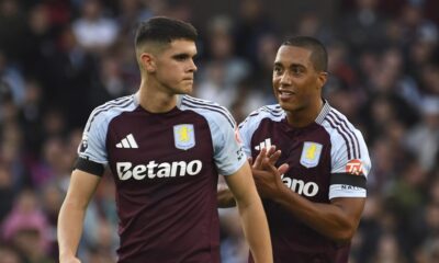 Aston Villa's Kosta Nedeljkovic, left, and Aston Villa's Youri Tielemans during the English Premier League soccer match between Aston Villa and Arsenal at Villa Park in Birmingham, England, Saturday, Aug. 24, 2024. (AP Photo/Rui Vieira)