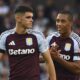 Aston Villa's Kosta Nedeljkovic, left, and Aston Villa's Youri Tielemans during the English Premier League soccer match between Aston Villa and Arsenal at Villa Park in Birmingham, England, Saturday, Aug. 24, 2024. (AP Photo/Rui Vieira)