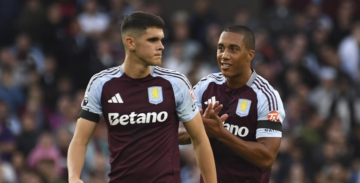 Aston Villa's Kosta Nedeljkovic, left, and Aston Villa's Youri Tielemans during the English Premier League soccer match between Aston Villa and Arsenal at Villa Park in Birmingham, England, Saturday, Aug. 24, 2024. (AP Photo/Rui Vieira)