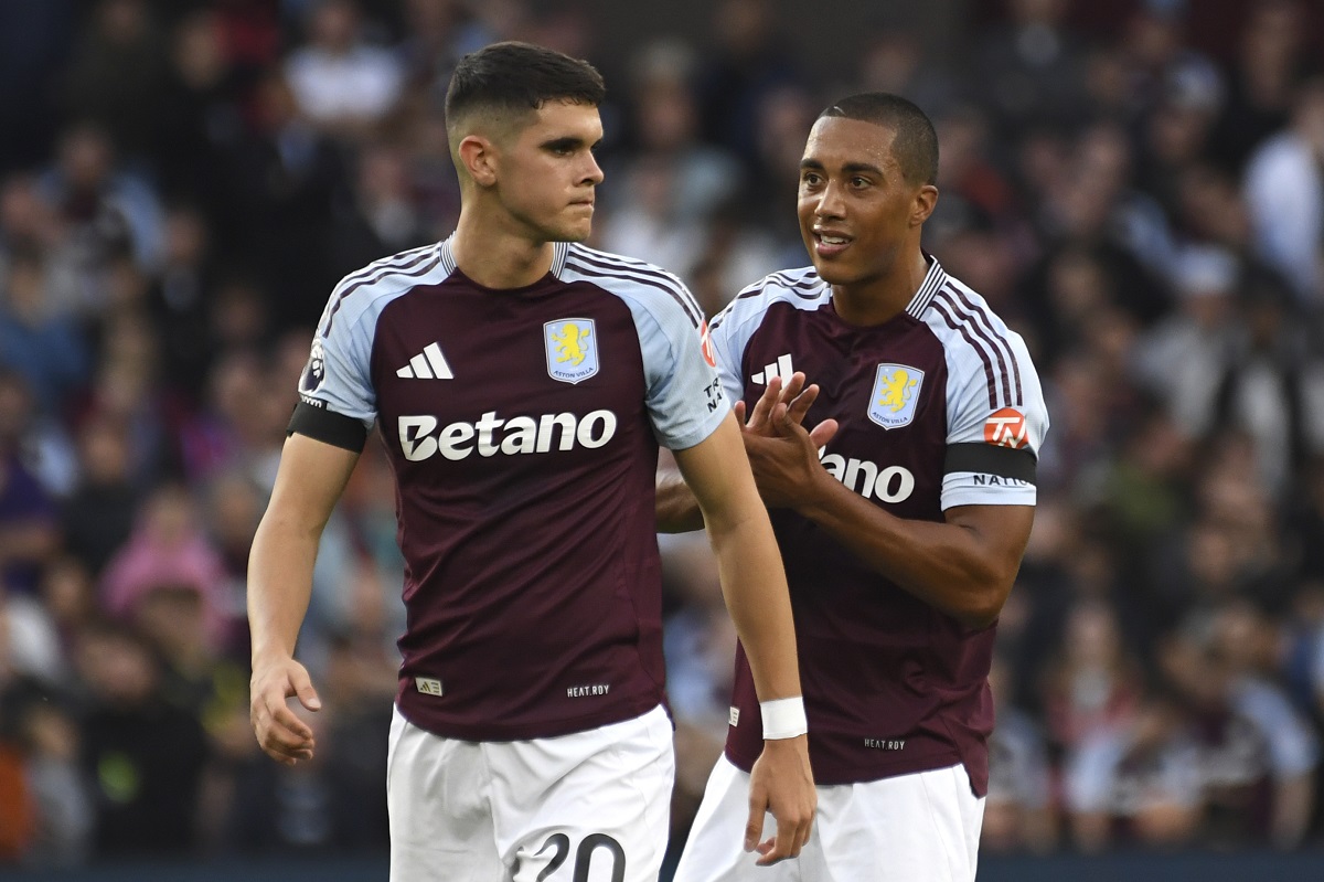 Aston Villa's Kosta Nedeljkovic, left, and Aston Villa's Youri Tielemans during the English Premier League soccer match between Aston Villa and Arsenal at Villa Park in Birmingham, England, Saturday, Aug. 24, 2024. (AP Photo/Rui Vieira)