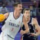 Strahinja Stojacic of Serbia drives past Jimmer Fredette of the United States in the men's 3x3 basketball pool round match between Serbia and the United States at the 2024 Summer Olympics, Tuesday, July 30, 2024, in Paris, France. (AP Photo/Rebecca Blackwell)