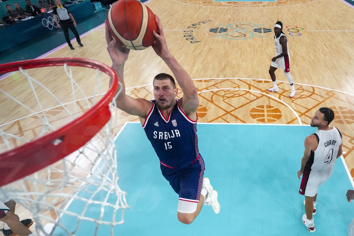 Nikola Jokic (15), of Serbia shoots during a men's semifinal basketball game against the United States at Bercy Arena at the 2024 Summer Olympics, Thursday, Aug. 8, 2024, in Paris, France. (AP Photo/Mark J. Terrill,Pool)