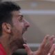 Novak Djokovic of Serbia reacts during a break as he plays against Lorenzo Musetti of Italy during their men's singles semifinals tennis match, at the 2024 Summer Olympics, Friday, Aug. 2, 2024, at the Roland Garros stadium in Paris, France. (AP Photo/Andy Wong)