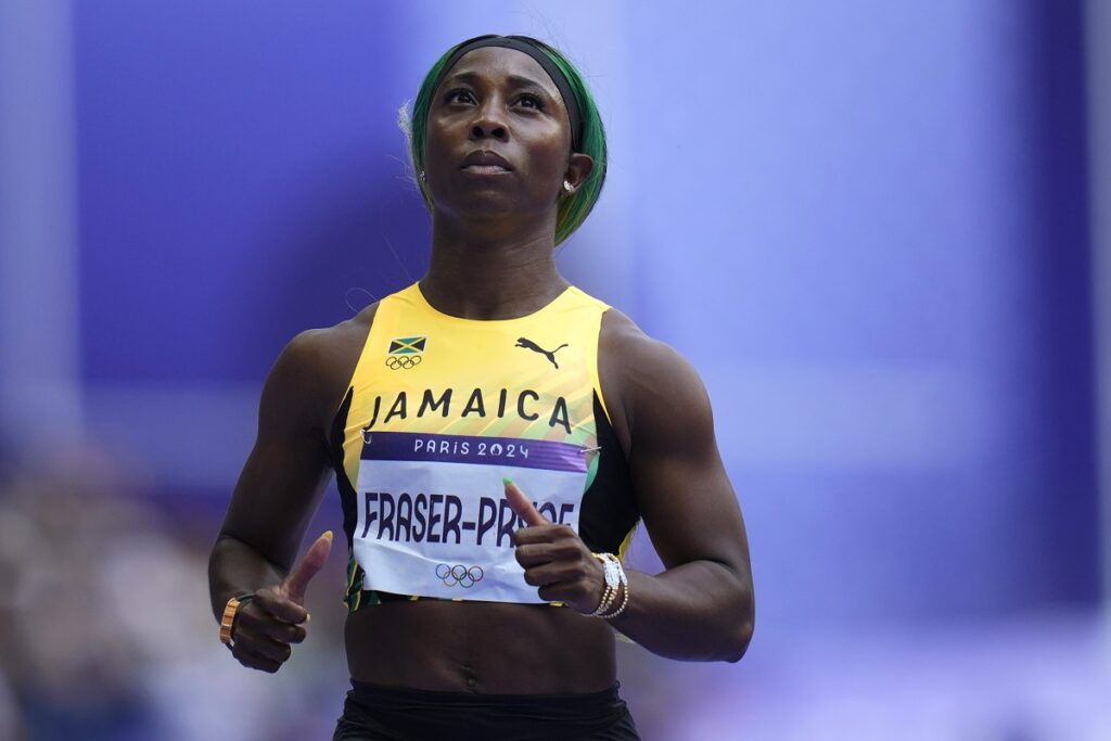 Shelly-Ann Fraser-Pryce, of Jamaica, runs in a women's 100-meter heat at the 2024 Summer Olympics, Friday, Aug. 2, 2024, in Saint-Denis, France. (AP Photo/Petr David Josek)