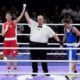 Taiwan's Lin Yu-ting celebrates after defeating Bulgaria's Svetlana Staneva in their women's 57 kg quarterfinal boxing match at the 2024 Summer Olympics, Sunday, Aug. 4, 2024, in Paris, France. (AP Photo/John Locher)