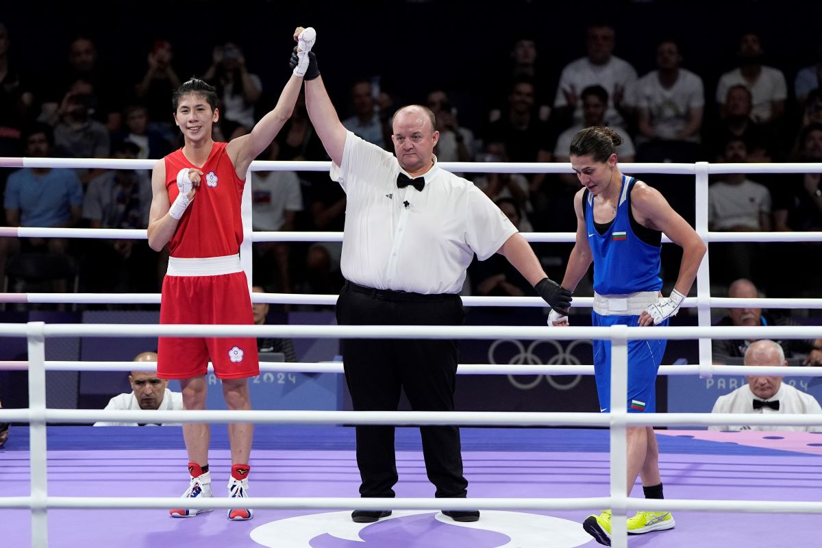 Taiwan's Lin Yu-ting celebrates after defeating Bulgaria's Svetlana Staneva in their women's 57 kg quarterfinal boxing match at the 2024 Summer Olympics, Sunday, Aug. 4, 2024, in Paris, France. (AP Photo/John Locher)