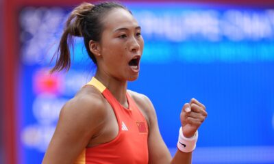 China's Zheng Qinwen clenches her fist after winning a point to Croatia's Donna Vekic during the Women's Singles tennis final at the Roland Garros stadium at the 2024 Summer Olympics, Saturday, Aug. 3, 2024, in Paris, France. (AP Photo/Manu Fernandez)