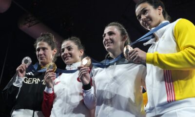 Medal winners, from left, Germany's Miriam Butkereit, silver, Croatia's Barbara Matic, gold, Austria's Michaela Polleres, Belgium's Gabriella Willems, bronze, pose after the podium of the women's -70kg event in the team judo competition, at Champ-de-Mars Arena, during the 2024 Summer Olympics, Wednesday, July 31, 2024, in Paris, France. (AP Photo/Eugene Hoshiko)