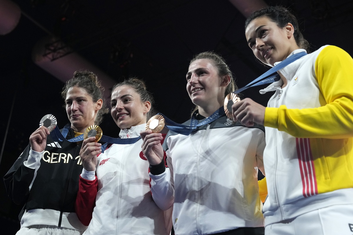 Medal winners, from left, Germany's Miriam Butkereit, silver, Croatia's Barbara Matic, gold, Austria's Michaela Polleres, Belgium's Gabriella Willems, bronze, pose after the podium of the women's -70kg event in the team judo competition, at Champ-de-Mars Arena, during the 2024 Summer Olympics, Wednesday, July 31, 2024, in Paris, France. (AP Photo/Eugene Hoshiko)