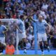 Manchester City's Erling Haaland, right, is congratulated by Ruben Dias after scoring his side's first goal from the penalty spot during the English Premier League soccer match between Manchester City and Ipswich Town at the Etihad Stadium in Manchester, England, Saturday, Aug. 24, 2024. (AP Photo/Dave Thompson)