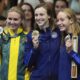 Australia's Ariarne Titmus, United States' Katie Ledecky and United States' Paige Madden celebrate with their medals during the awards ceremony for women's 800-meter freestyle the at the Summer Olympics in Nanterre, France, Saturday, Aug. 3, 2024. (AP Photo/Brynn Anderson)