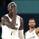 Germany's Isaac Bonga, left, and Germany's Nick Weiler-Babb gesture after scoring during a men's basketball game against Greece at the 2024 Summer Olympics, Tuesday, Aug. 6, 2024, in Villeneuve-d'Ascq, France. (AP Photo/Michael Conroy)