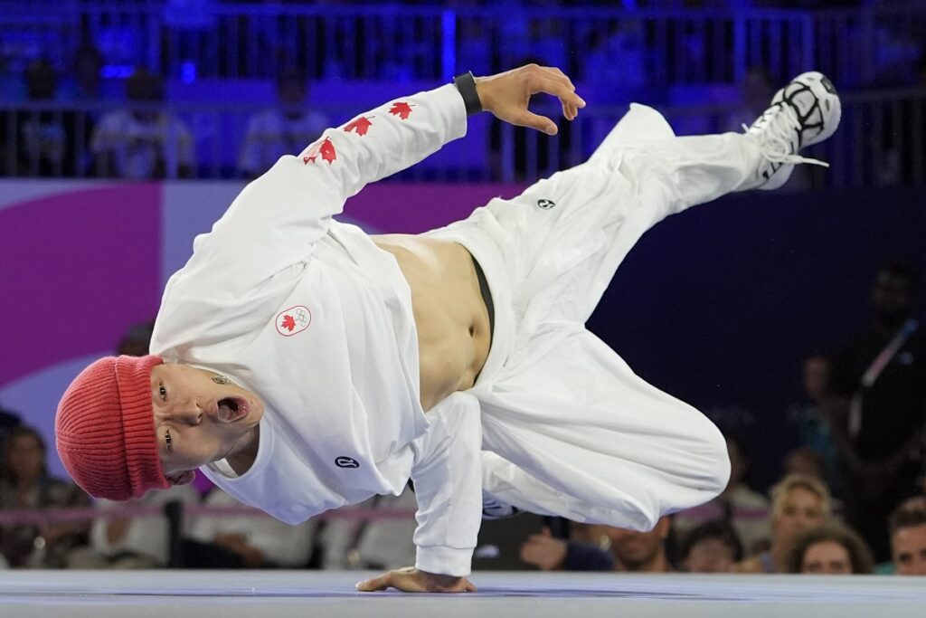 Canada's Philip Kim, known as B-Boy Phil Wizard competes during the B-Boys gold medal battle for the breaking competition at La Concorde Urban Park at the 2024 Summer Olympics, Saturday, Aug. 10, 2024, in Paris, France. (AP Photo/Frank Franklin II)