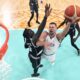 Serbia's Nikola Jokic, right, shoots as South Sudan's Wenyen Gabriel defends during a men's basketball game at the 2024 Summer Olympics, Saturday, Aug. 3, 2024, in Villeneuve-d'Ascq, France. (AP Photo/Michael Conroy, Pool)