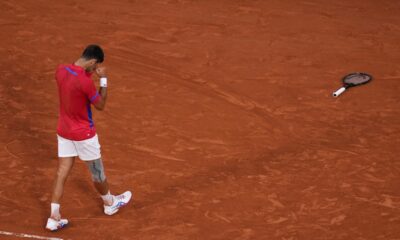 Novak Djokovic of Serbia celebrates after defeating Lorenzo Musetti of Italy in their men's singles semifinals tennis match, at the 2024 Summer Olympics, Friday, Aug. 2, 2024, at the Roland Garros stadium in Paris, France. (AP Photo/Manu Fernandez)