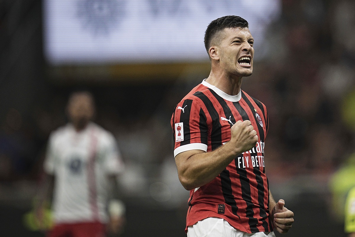 AC Milan's Luka Jović celebrates after the second their goal against Monza during the Silvio Berlusconi Trophy (Trofeo Berlusconi) soccer match at the San Siro Stadium in Milan, Italy, Tuesday, Aug. 13, 2024. (Marco Alpozzi/LaPresse via AP)