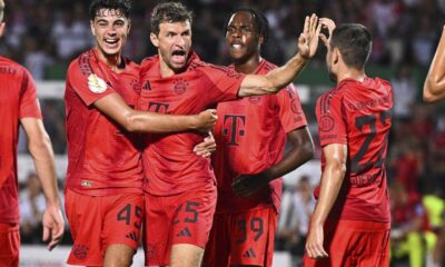 Bayern Munich's Thomas Müller, second from left, celebrates after scoring a goal during a DFB Cup first round soccer match against Ulm, Friday, Aug. 16, 2024, in Ulm, Germany. (Tom Weller/dpa via AP)