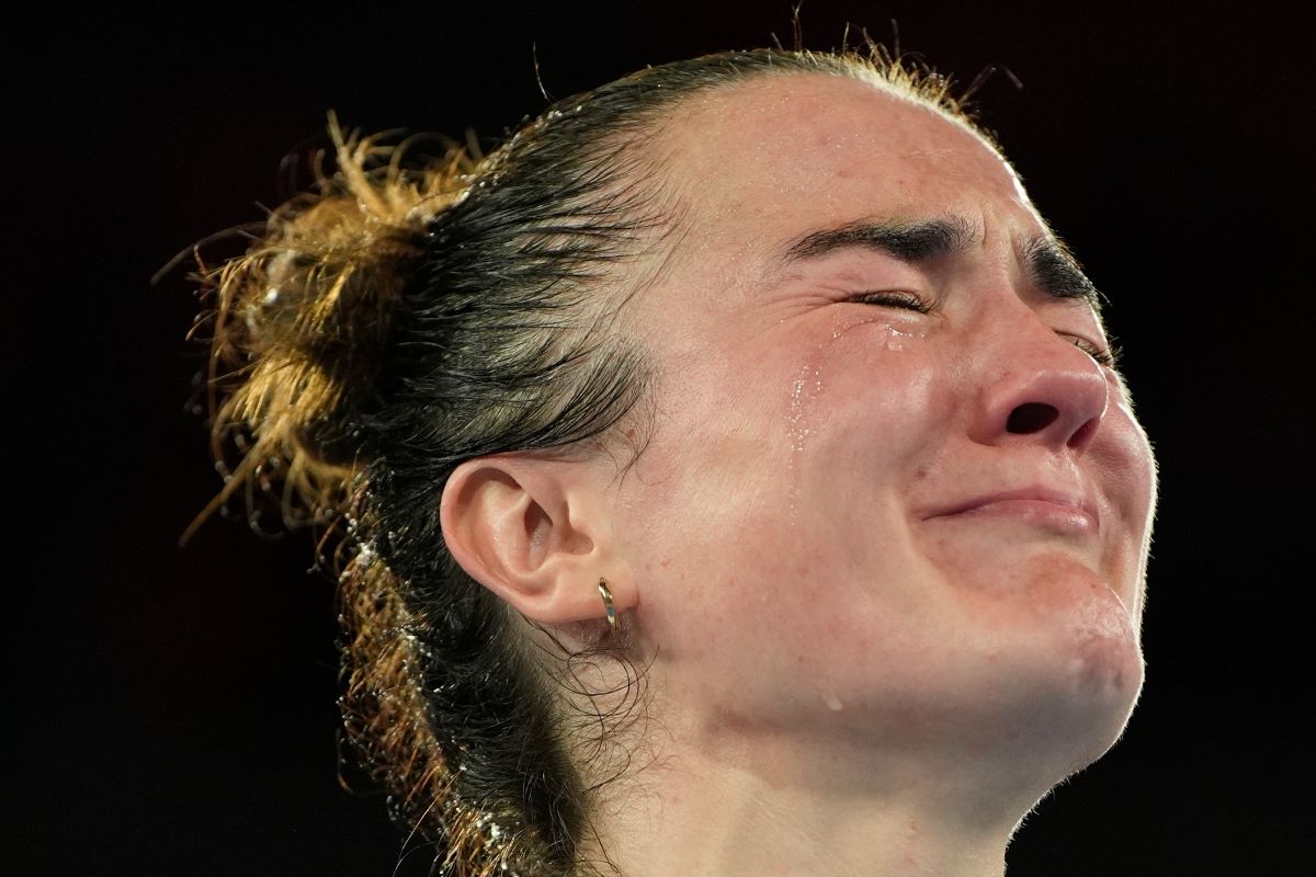 Gold medalist Ireland's Kellie Harrington reacts during the medals ceremony for the women's 60 kg final boxing at the 2024 Summer Olympics, Wednesday, Aug. 7, 2024, in Paris, France. (AP Photo/John Locher)