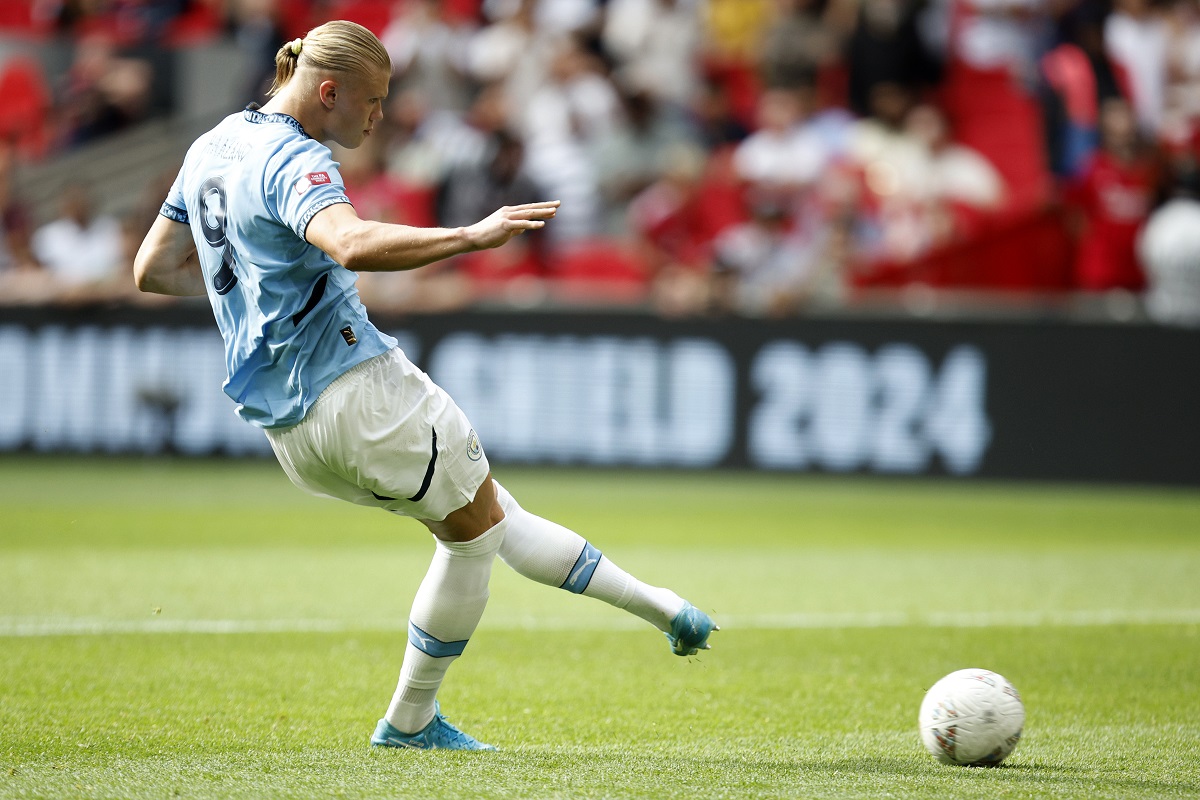 Manchester City forward Erling Haaland kicks a penalty during the FA Community Shield soccer match between Manchester City and Manchester United at Wembley Stadium in London, Saturday, Aug. 10, 2024. (AP Photo/David Cliff)