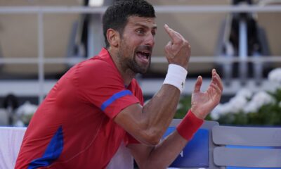 Novak Djokovic of Serbia reacts during a break as he plays against Lorenzo Musetti of Italy during their men's singles semifinals tennis match, at the 2024 Summer Olympics, Friday, Aug. 2, 2024, at the Roland Garros stadium in Paris, France. (AP Photo/Andy Wong)