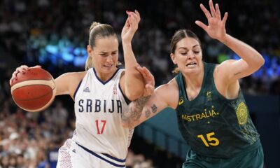 Jovana Nogic (17), of Serbia, shoots on Cayla George (15), of Australia, during a women's quarterfinal game at Bercy Arena at the 2024 Summer Olympics, Wednesday, Aug. 7, 2024, in Paris, France. (AP Photo/Mark J. Terrill)