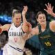 Jovana Nogic (17), of Serbia, shoots on Cayla George (15), of Australia, during a women's quarterfinal game at Bercy Arena at the 2024 Summer Olympics, Wednesday, Aug. 7, 2024, in Paris, France. (AP Photo/Mark J. Terrill)