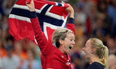 Norway goalkeeper Katrine Lunde, left, celebrates victory after the gold medal handball match between Norway and France at the 2024 Summer Olympics, Saturday, Aug. 10, 2024, in Villeneuve-d'Ascq, France. (AP Photo/Aaron Favila)