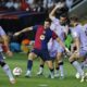 Barcelona's Robert Lewandowski, centre, passes the ball during the Spanish La Liga soccer match between FC Barcelona and Athletic Bilbao at the Olympic stadium in Barcelona, Spain, Saturday, Aug. 24, 2024. (AP Photo/Joan Monfort)