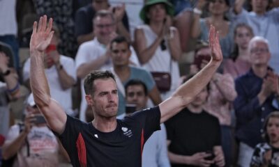 Andy Murray of Britain cries and waves to the spectators after he and his partner Daniel Evans defeated by Taylor Fritz and Tommy Paul of the United States in the men's doubles quarterfinals tennis match, at the 2024 Summer Olympics, Thursday, Aug.1, 2024, at the Roland Garros stadium in Paris, France. (AP Photo/Andy Wong)