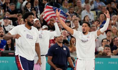 Team USA celebrates after scoring a basket against France during a men's gold medal basketball game at Bercy Arena at the 2024 Summer Olympics, Saturday, Aug. 10, 2024, in Paris, France. (AP Photo/Rebecca Blackwell)