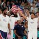 Team USA celebrates after scoring a basket against France during a men's gold medal basketball game at Bercy Arena at the 2024 Summer Olympics, Saturday, Aug. 10, 2024, in Paris, France. (AP Photo/Rebecca Blackwell)