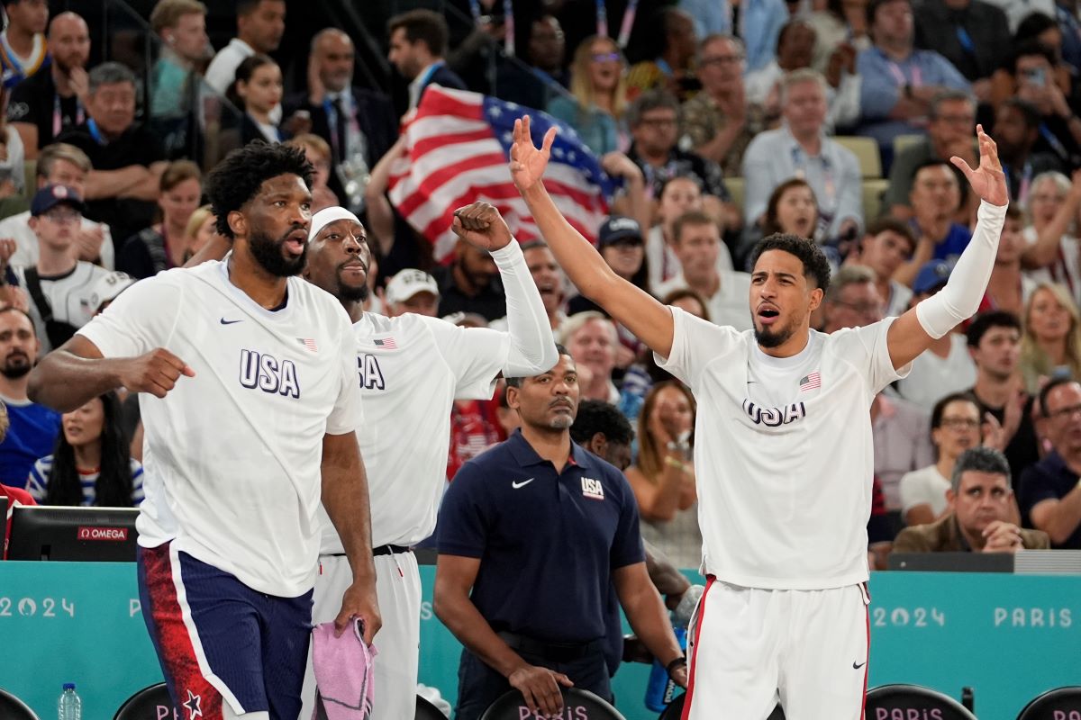 Team USA celebrates after scoring a basket against France during a men's gold medal basketball game at Bercy Arena at the 2024 Summer Olympics, Saturday, Aug. 10, 2024, in Paris, France. (AP Photo/Rebecca Blackwell)